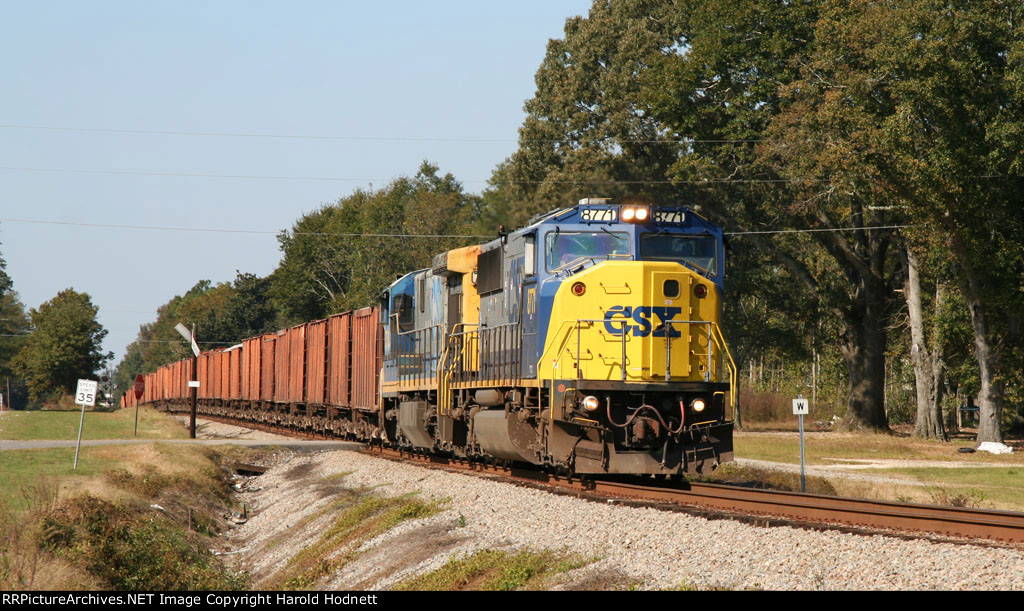 CSX 8771 & 7088 lead a ballast train